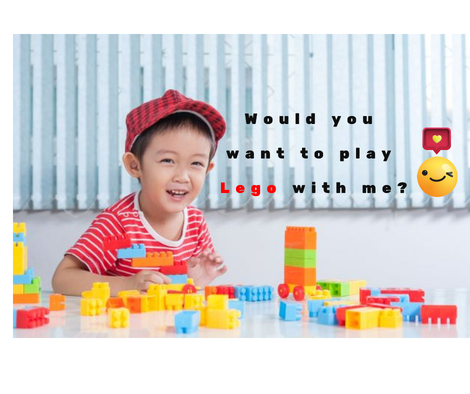 happy kid playing Lego